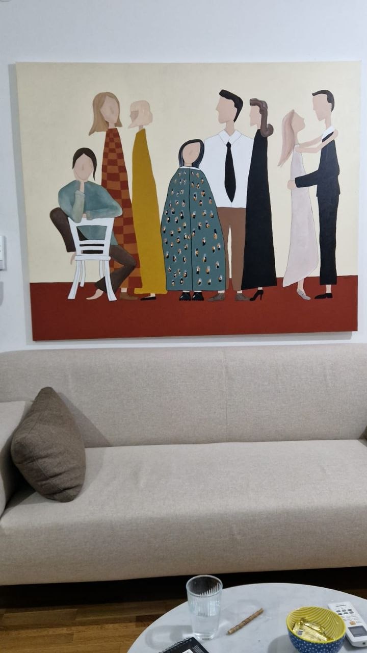 Large Dekart painting displayed above a sofa.
